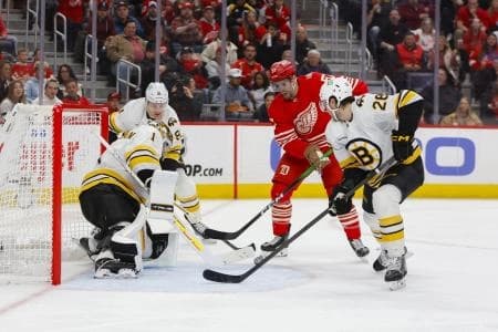 Detroit Red Wings left wing David Perron (57) takes a shot on Boston Bruins goaltender Jeremy Swayman (1) during the second period at Little Caesars Arena.