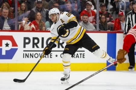 Boston Bruins right wing David Pastrnak (88) shoots the puck during the first period against the Detroit Red Wings at Little Caesars Arena.