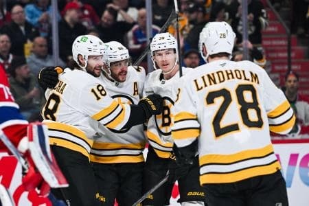 Boston Bruins center Pavel Zacha (18) celebrates with his teammates his goal against the Montreal Canadiens during the first period at Bell Centre.