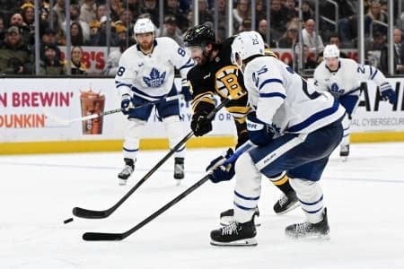 Boston Bruins center Mark Kastelic (47) controls the puck against Toronto Maple Leafs defenseman Brandon Carlo (25) during the third period at the TD Garden.