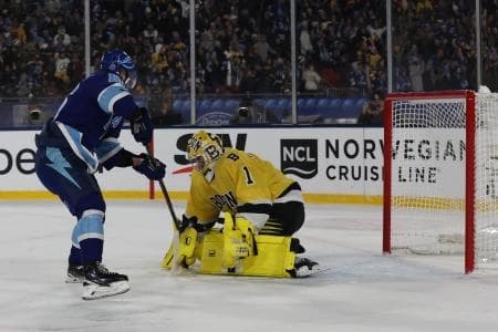 Boston Bruins goaltender Jeremy Swayman (1) makes the save on Tampa Bay Lightning right wing Nikita Kucherov (86) during overtime in the 2026 Stadium Series ice hockey game at Raymond James Stadium.
