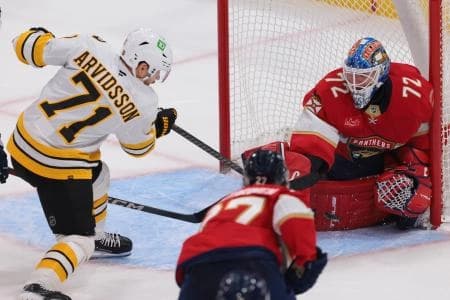 Florida Panthers goaltender Sergei Bobrovsky (72) makes a save against Boston Bruins left wing Viktor Arvidsson (71) during the third period at Amerant Bank Arena.