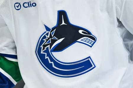 View of a Vancouver Canucks logo on a jersey worn by a member of the team during the second period at Bell Centre.