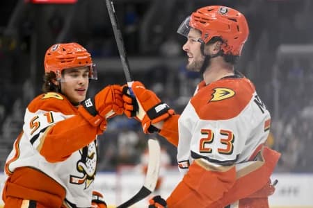 Anaheim Ducks center Mason McTavish (23) is congratulated by defenseman Olen Zellweger (51) after scoring against the St. Louis Blues during the first period at Enterprise Center.