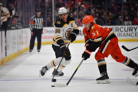 Boston Bruins right wing David Pastrnak (88) loses the puck against Anaheim Ducks defenseman Olen Zellweger (51) during the third period at Honda Center.