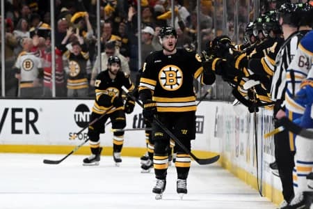 Boston Bruins left wing Tanner Jeannot (84) celebrates with his teammates after scoring a goal against the Buffalo Sabres during the second period of game three of the first round of the 2026 Stanley Cup Playoffs at the TD Garden.