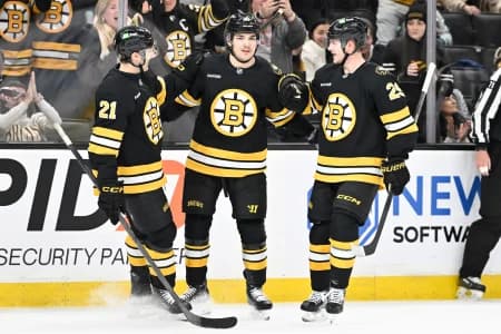 Boston Bruins center Michael Eyssimont (81) celebrates his goal with center Alex Steeves (21) and defenseman Victor Soderstrom (29) during the third period against the Utah Mammoth at TD Garden.