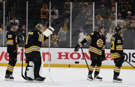 Boston Bruins center Morgan Geekie (39), goaltender Jeremy Swayman (1), center Fraser Minten (93) and center Alex Steeves (21) head for the locker room after their 4-1 loss to the Buffalo Sabres in game six of the first round of the 2026 Stanley Cup Playoffs at TD Garden.