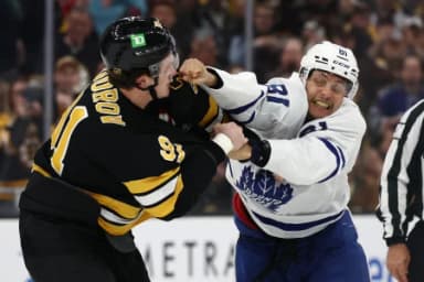 Toronto Maple Leafs center Dakota Joshua (81) fights with Boston Bruins defenseman Nikita Zadorov (91) during the third period at TD Garden.