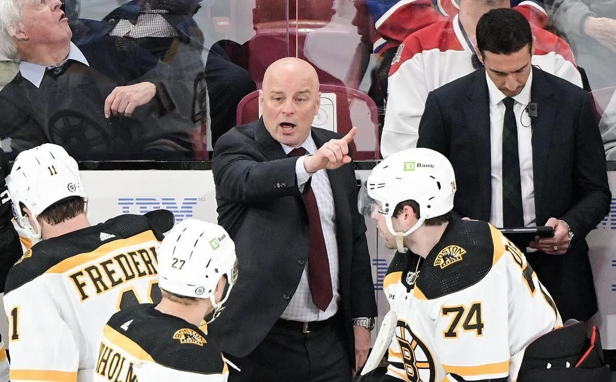 Jim Montgomery behind the Bruins bench