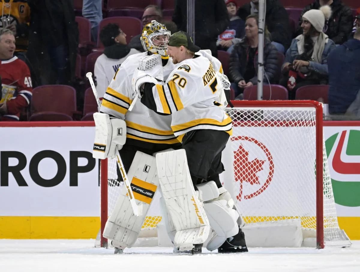 Boston Bruins goalie Jeremy Swayman (1) and teammate goalie Joonas Korpisalo (70) celebrates the win against the Montreal Canadiens at the Bell Centre.