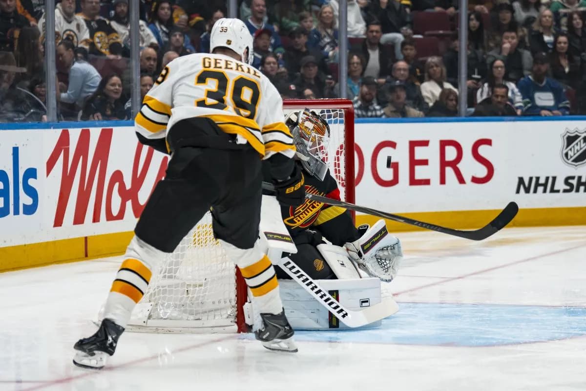 Vancouver Canucks goalie Kevin Lankinen (32) makes a save on Boston Bruins forward Morgan Geekie (39) in the first period at Rogers Arena.