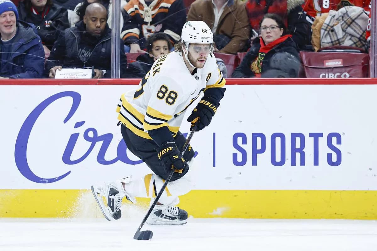 Boston Bruins right wing David Pastrnak (88) looks to pass the puck against the Chicago Blackhawks during the first period at United Center.