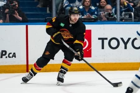Vancouver Canucks forward Jake DeBrusk (74) handles the puck against the Toronto Maple Leafs in the second period at Rogers Arena.