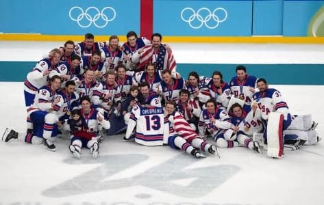 The United States celebrates after winning the men's ice hockey gold medal game during the Milano Cortina 2026 Olympic Winter Games at Milano Santagiulia Ice Hockey Arena.