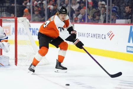 Philadelphia Flyers right wing Owen Tippett (74) reaches for the puck against the New York Islanders in the first period at Xfinity Mobile Arena.