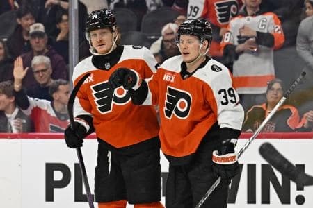 Philadelphia Flyers right wing Owen Tippett (74) celebrates his goal with right wing Matvei Michkov (39) against the Tampa Bay Lightning during the third period at Xfinity Mobile Arena.