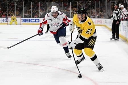 Boston Bruins center Alex Steeves (21) attempts a shot against the Washington Capitals during the third period at the TD Garden.