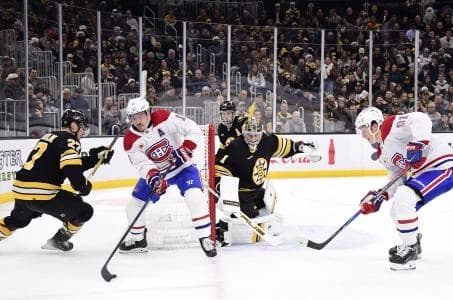 Montreal Canadiens right wing Brendan Gallagher (11) controls the puck in front of Boston Bruins goaltender Jeremy Swayman (1) during the second period at TD Garden.