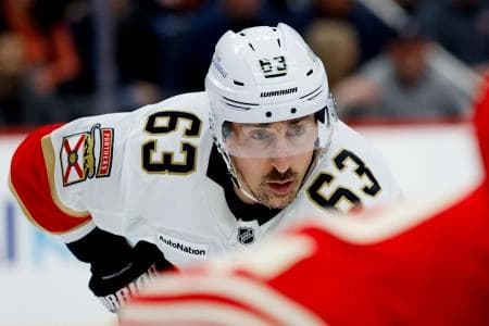 Florida Panthers left wing Brad Marchand (63) gets set during a face-off in the first period against the Detroit Red Wings at Little Caesars Arena.