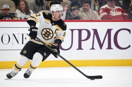 Boston Bruins left wing Brad Marchand (63) skates with the puck against the Pittsburgh Penguins during the first period at PPG Paints Arena