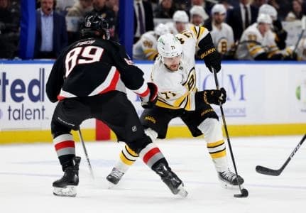 Boston Bruins left wing Viktor Arvidsson (71) skates with the puck as Buffalo Sabres right wing Alex Tuch (89) defends during the third period at KeyBank Center.
