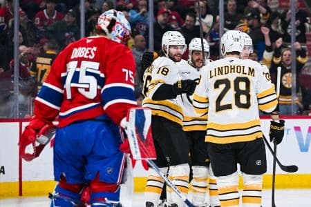 Boston Bruins center Pavel Zacha (18) celebrates with his teammates his goal against Montreal Canadiens goalie Jakub Dobes (75) during the first period at Bell Centre.