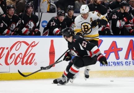 Boston Bruins right wing David Pastrnak (88) tries to play the puck during the third period against the Buffalo Sabres at KeyBank Center.