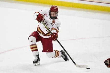 Boston College forward James Hagens (10) shoots the puck against the University of New Hampshire Wildcats during the third period at Conte Forum