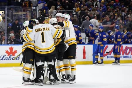 The Boston Bruins celebrate a win over the Buffalo Sabres at KeyBank Center.