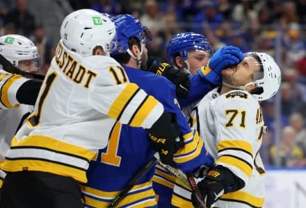 The Boston Bruins and the Buffalo Sabres players get into a scrum after the whistle during the first period at KeyBank Center.