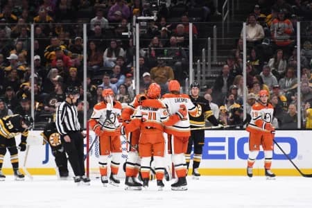 Anaheim Ducks center Mikael Granlund (64) is congratulated by his teammates after scoring a goal during the third period against the Boston Bruins at TD Garden.