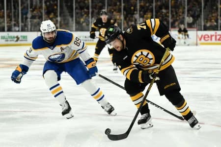 Boston Bruins left wing Viktor Arvidsson (71) skates against Buffalo Sabres right wing Alex Tuch (89) during the third period of game three of the first round of the 2026 Stanley Cup Playoffs at the TD Garden.