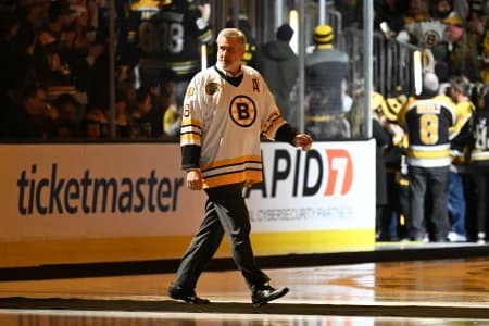 Former Boston Bruins Cam Neely walks onto the ice during a ceremony before before a game against the Montreal Canadiens at the TD Garden.