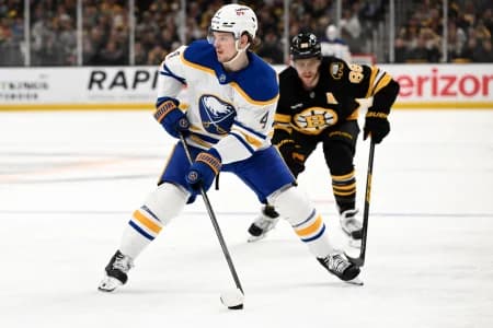 Buffalo Sabres defenseman Bowen Byram (4) skates against Boston Bruins right wing David Pastrnak (88) during the second period of game three of the first round of the 2026 Stanley Cup Playoffs at the TD Garden.