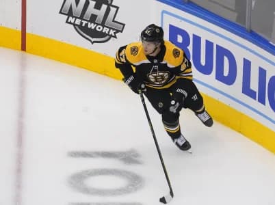 Boston Bruins defenseman Torey Krug (47) moves the puck against the Carolina Hurricanes during the first period in game five of the first round of the 2020 Stanley Cup Playoffs at Scotiabank Arena.