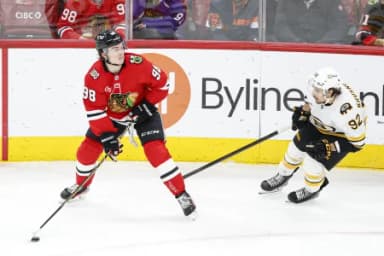 Boston Bruins center Marat Khusnutdinov (92) defends against Chicago Blackhawks center Connor Bedard (98) during the third period at United Center
