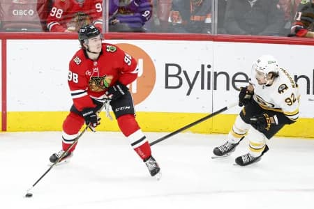 Boston Bruins center Marat Khusnutdinov (92) defends against Chicago Blackhawks center Connor Bedard (98) during the third period at United Center